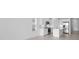 Modern kitchen with white cabinets and stainless steel appliances at 18260 Vizcaya Ct, Venice, FL 34293
