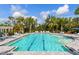 Community pool with lounge chairs and a pergola at 18260 Vizcaya Ct, Venice, FL 34293