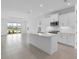 Modern kitchen with island, stainless steel appliances, and water view at 18260 Vizcaya Ct, Venice, FL 34293