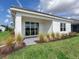 Back exterior view showing patio and lake view at 18260 Vizcaya Ct, Venice, FL 34293