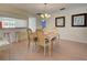 Elegant dining room with hardwood floors and a lovely table setting for four at 314 Cerromar Way # 16, Venice, FL 34293