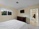Bedroom with a queen bed and access to a hallway at 424 Baycrest Dr, Venice, FL 34285