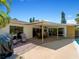 Spacious patio, covered area, pool view, grill at 424 Baycrest Dr, Venice, FL 34285