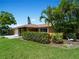 Single story home with attached garage and lush landscaping at 424 Baycrest Dr, Venice, FL 34285