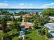 Waterfront property with pool and tropical landscaping at 424 Baycrest Dr, Venice, FL 34285