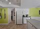 Kitchen with white cabinetry, stainless steel appliances, and a breakfast bar at 424 Baycrest Dr, Venice, FL 34285