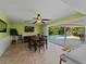 Dining room with sliding doors leading to a pool and patio at 424 Baycrest Dr, Venice, FL 34285