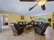 Open living room with comfortable seating, large windows, and ceiling fan at 424 Baycrest Dr, Venice, FL 34285