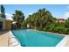 Inviting rectangular swimming pool, lush landscaping at 424 Baycrest Dr, Venice, FL 34285