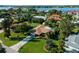Aerial view of a single-Gathering home with a pool, lush landscaping, and a waterfront location at 424 Baycrest Dr, Venice, FL 34285
