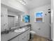 Modern bathroom with gray vanity and shower at 424 Baycrest Dr, Venice, FL 34285