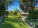 Landscaped backyard with pool and lush foliage at 424 Baycrest Dr, Venice, FL 34285