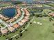 Aerial view of a home near a golf course at 145 Montelluna Dr, North Venice, FL 34275