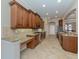 Modern kitchen with granite countertops, stainless steel appliances, and wood cabinets at 145 Montelluna Dr, North Venice, FL 34275