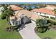 Luxury house with a tile roof and a large driveway at 145 Montelluna Dr, North Venice, FL 34275