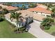 Luxury house with a tile roof and a large driveway at 145 Montelluna Dr, North Venice, FL 34275