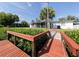 Backyard with a wooden walkway leading to the canal at 605 Barnes Pkwy, Nokomis, FL 34275