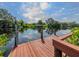 Wooden dock offering scenic views and access to the water at 605 Barnes Pkwy, Nokomis, FL 34275