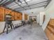 Unfinished garage with tools and workbench at 605 Barnes Pkwy, Nokomis, FL 34275