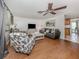 Bright living room with hardwood floors and comfy seating at 605 Barnes Pkwy, Nokomis, FL 34275