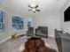 Bright Bedroom featuring a crib, seating, and ample natural light at 2585 Hobblebrush Dr, North Port, FL 34289