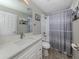 Neat bathroom with single vanity and shower/tub combo at 2585 Hobblebrush Dr, North Port, FL 34289