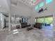 Open living room and kitchen with high ceilings and island at 2585 Hobblebrush Dr, North Port, FL 34289