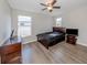 Spacious bedroom with a queen-size bed, dresser, and large window at 2585 Hobblebrush Dr, North Port, FL 34289