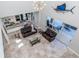 Two-story living room with open floor plan and access to patio at 2585 Hobblebrush Dr, North Port, FL 34289