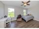Charming bedroom with a desk, chair, and full-size bed at 2585 Hobblebrush Dr, North Port, FL 34289