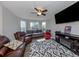 Relaxing Gathering room with leather furniture and a built-in fireplace at 2585 Hobblebrush Dr, North Port, FL 34289