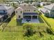 Aerial view of two-story house, fenced backyard, and community at 2585 Hobblebrush Dr, North Port, FL 34289