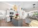 Bright kitchen with large island, white cabinets, and granite countertops at 1211 Cheshire, Port Charlotte, FL 33953