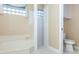 Bathroom with shower, toilet, and updated fixtures at 653 Crossfield Cir # 8, Venice, FL 34293