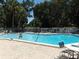 Refreshing community pool with lounge chairs at 1154 Bird Bay Way # 303, Venice, FL 34285