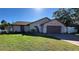 Single-story house with a brown garage door and well-maintained lawn at 151 Shamrock Dr, Venice, FL 34293