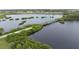 Aerial view of the community with a bridge and waterway at 886 Bird Bay Way # 206, Venice, FL 34285