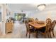 Dining area with wooden table and six chairs at 886 Bird Bay Way # 206, Venice, FL 34285