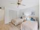 Guest bedroom with two twin beds and plenty of closet space at 886 Bird Bay Way # 206, Venice, FL 34285