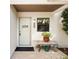 Condo entrance with a small table and potted plants at 886 Bird Bay Way # 206, Venice, FL 34285