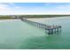 Aerial view of a pier at the beach with people on it at 886 Bird Bay Way # 206, Venice, FL 34285