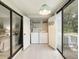 Laundry room with washer and dryer, and access from the sunroom at 886 Bird Bay Way # 206, Venice, FL 34285