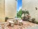 Relaxing courtyard with seating area and tropical plants at 618 Bird Bay S Dr # 202, Venice, FL 34285
