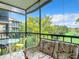Enjoy the view from this lanai, complete with wicker furniture at 618 Bird Bay S Dr # 202, Venice, FL 34285