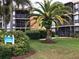 Two-story condo building with palm trees at 618 Bird Bay S Dr # 202, Venice, FL 34285