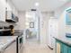 Bright kitchen with granite counters and stainless steel appliances at 618 Bird Bay S Dr # 202, Venice, FL 34285
