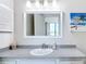 Updated bathroom with new vanity and mirror, offering natural light at 618 Bird Bay S Dr # 202, Venice, FL 34285
