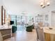 Bright living room with tiled floors and access to a balcony at 618 Bird Bay S Dr # 202, Venice, FL 34285