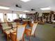 Community room with comfortable seating and bookshelves at 618 Bird Bay S Dr # 202, Venice, FL 34285