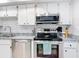 Kitchen with stainless steel appliances and granite counters at 618 Bird Bay S Dr # 202, Venice, FL 34285